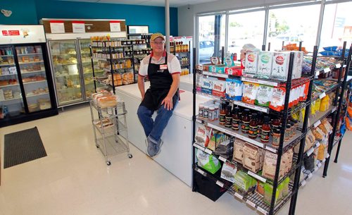 BORIS MINKEVICH / WINNIPEG FREE PRESS
Local Meats & Frozen Treats, 593 St. Anne's Rd.  Sunday Special feature on Ken Loney, 60, who opened Local Meats  & Frozen Treats  after a long, long career in the TV repair biz. Here he sits on a freezer in the store. DAVE SANDERSON STORY. May 24, 2017