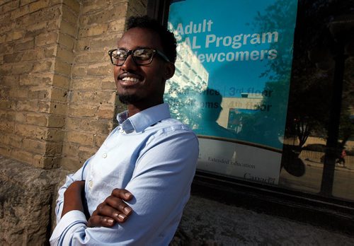 PHIL HOSSACK / WINNIPEG FREE PRESS  -   Posing downtown, Yahya Samatar, the refugee claimant who swam up the Red River into Canada in Aug. 2015  He was accepted as a refugee and now hes promoting the Fast and Furious Feast on Friday  its a Winnipeg Harvest fundraiser  he works full time as a fund-raising consultant with Creaddo Group, is talking top-level ESL classes so he can attend university and volunteering with Welcome Place helping refugee claimants and other newcomers. For Sanders story running Thursday   -  May 24 2017