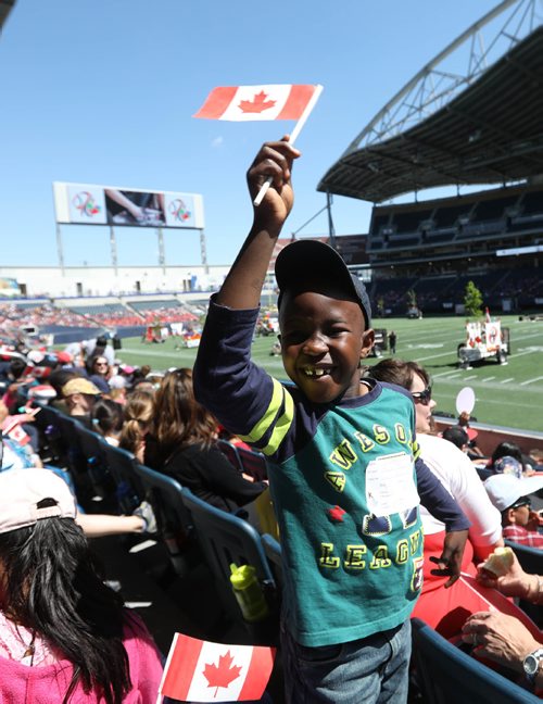RUTH BONNEVILLE /  WINNIPEG FREE PRESS

Dami Oloko waves his little Canada flag while grouped with his fellow classmates from Ralph Maybank School in the stands of Investors Group Field with 15,000  thousand  Pembina Trails school division students for Canada 150 celebrations Wednesday. 


May 24, 2017