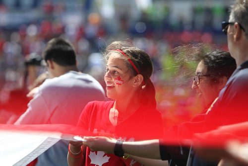 RUTH BONNEVILLE /  WINNIPEG FREE PRESS

Grade 6 Oakenwald student Neve Neto holds onto a corner of a large Canada Flag on Investors Group Fields with other student representatives of Pembina Trails school division as more than 15,000 students gathered at IGF for Canada 150 Project, one of the biggest school-based  events in the country on Wednesday. 

May 24, 2017