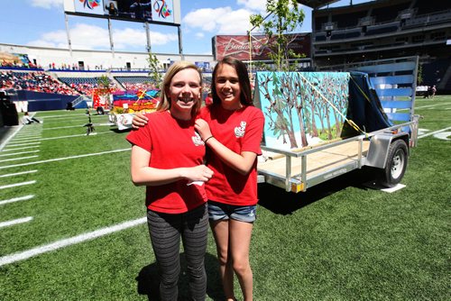 RUTH BONNEVILLE /  WINNIPEG FREE PRESS

Rachel Coutts (left) and Zoe Brodt from Ecole Tuxedo Park stand next to their school's float as they prepare to give a short speech in French on Investors Group Field with 15,000  thousand  Pembina Trails school division students in the stands for Canada 150 event  at Investors Group Field Wednesday. 


May 24, 2017