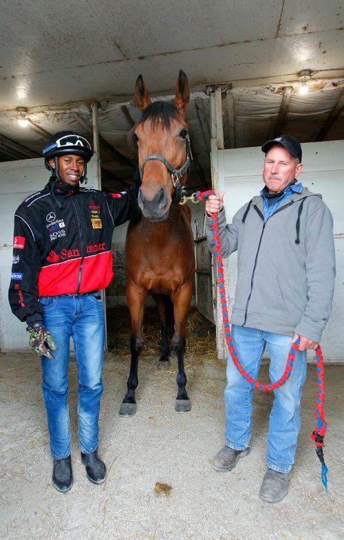 BORIS MINKEVICH / WINNIPEG FREE PRESS
From left, jockey Dario Dalrymple, horse named Golds Venice, and owner-trainer Curtis Maxwell. The stable is called "Club 3D". Story is about longshot horses and jockeys at Assiniboia Downs. This small stable underdog is off to good start. Photo taken in the stables at the track. GEORGE WILLIAMS STORY. May 25, 2017