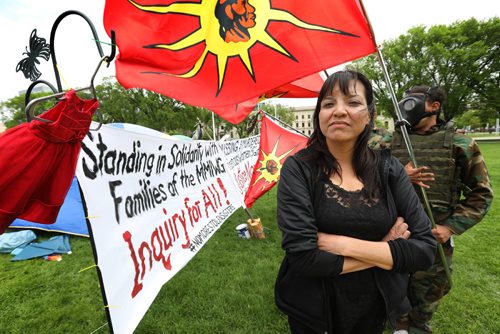 RUTH BONNEVILLE /  WINNIPEG FREE PRESS


A protest camp set up for Murdered and Missing Indigenous Women (MMIW) set up by Kim Kostiuk  with signs and red dresses at Memorial Park Thursday. Supporters of the camp including Angelina MacLeod who also has a sister that went missing and was found dead, guard the camp Thursday. 
See Melissa Martin feature strory.  

May 24, 2017