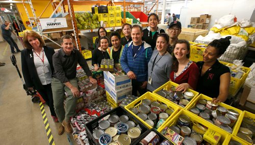 WAYNE GLOWACKI / WINNIPEG FREE PRESS 

At left, Winnipeg Harvest executive director David Northcott and his successor Kate Brenner, Managing Director in the warehouse with some of the food bank workers who have been certified as members of CUPE which is currently in negotiations with Harvest. Gord Sinclair story   May 25 2017