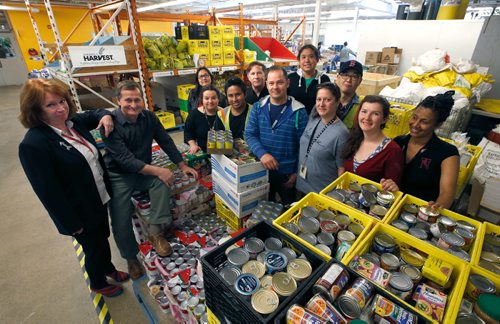 WAYNE GLOWACKI / WINNIPEG FREE PRESS 

At left, Winnipeg Harvest executive director David Northcott and his successor Kate Brenner, Managing Director in the warehouse with some of the food bank workers who have been certified as members of CUPE which is currently in negotiations with Harvest. Gord Sinclair story   May 25 2017