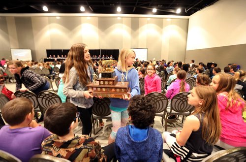 

RUTH BONNEVILLE /  WINNIPEG FREE PRESS

Ecole Lacerte school patrol captions Naomi Delaquis (left) and Sara Napastiuk  carry their trophy for 1st in the City-Wide School Patrol teams to show their fellow patrols during 43rd Annual School Safety Patrol Awards at the Convention Centre Thursday.  
Standup photo 
May 24, 2017