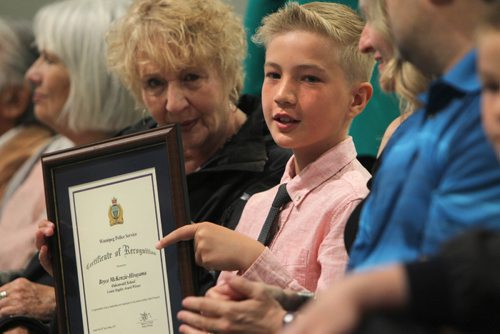 RUTH BONNEVILLE /  WINNIPEG FREE PRESS

Bryce McKenzie-Hirayama of Oakenwald School proudly holds his Louise Staples Award Certificate of Recognition from the Winnipeg Police Service for his service as a school patrol during 43rd Annual School Safety Patrol Awards at the Convention Centre Thursday.  
 Standup


May 24, 2017