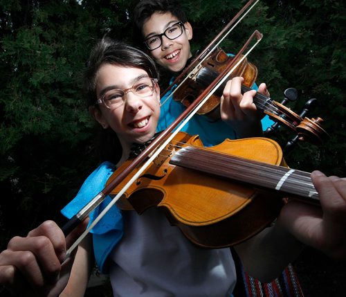 PHIL HOSSACK / WINNIPEG FREE PRESS - Brother-sister Métis fiddling-jigging duo Ryan, 14, and Clarissa, 12, Spence. They will be performing Sunday at the Teddy Bear Picnic and donating a portion of their earnings to the Children's Hospital Foundation.Clarissa was born three months premature, was nine weeks in NICU and six months in hospital. At first, she was not expected to survive. Now at age 12, she is a vibrant and talented young performer who along with her brother continue to give back to the hospital that saved her life. Kevin Rollason's story.  -  May 25 2017