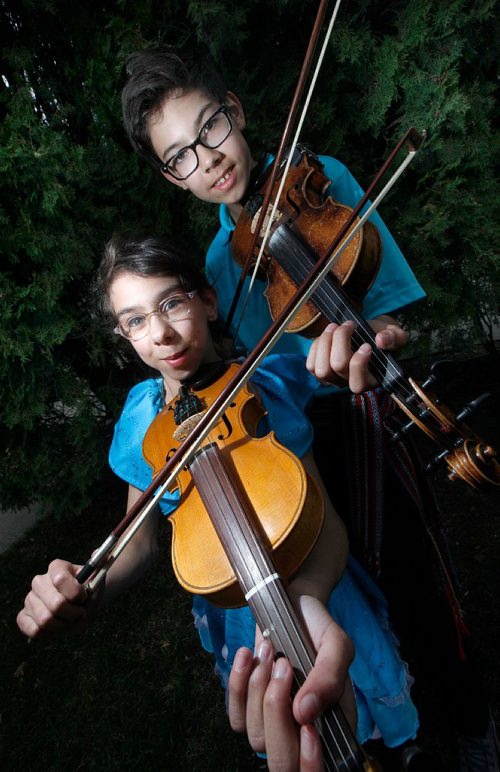 PHIL HOSSACK / WINNIPEG FREE PRESS - Brother-sister Métis fiddling-jigging duo Ryan, 14, and Clarissa, 12, Spence. They will be performing Sunday at the Teddy Bear Picnic and donating a portion of their earnings to the Children's Hospital Foundation.Clarissa was born three months premature, was nine weeks in NICU and six months in hospital. At first, she was not expected to survive. Now at age 12, she is a vibrant and talented young performer who along with her brother continue to give back to the hospital that saved her life. Kevin Rollason's story.  -  May 25 2017