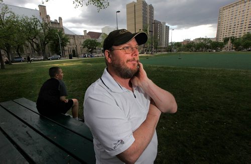 PHIL HOSSACK / WINNIPEG FREE PRESS  -   A wistfull Matt Bushby reflects on the loss of his fiancee Claudette Osborne while surveying the Central Park area they lived in ten years ago. Thier son Iziah sits behind him. See Dave Baxter story.    -  May 26 2017