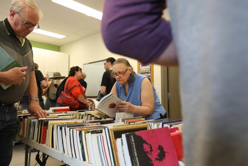 RUTH BONNEVILLE /  WINNIPEG FREE PRESS

BOOKS FOR CONVICTS -  People browse through books at the Daniel McIntyre/St. Matthews Community Association with proceeds for convicts Saturday.  Volunteers with the Manitoba Library Association's Prison Libraries Committee run libraries in four jails around the province and ran this unusual book and bake sale.  
See story.

May 27, 2017