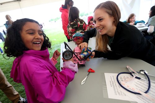 TREVOR HAGAN / WINNIPEG FREE PRESS
Mila Mathu, 6, has her doll checked out by Rachel Kesselman in the Dr.Goodbear Tent at the Teddy Bear Picnic, Sunday, May 28, 2017.