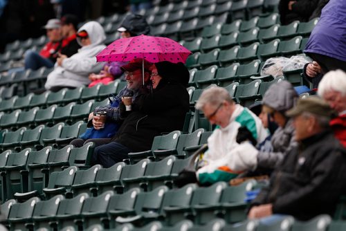 JOHN WOODS / WINNIPEG FREE PRESS
Winnipeg Goldeyes' fans cover up during a light right prior to their opening game against the Sioux Falls Canaries in Winnipeg Monday, May 29, 2017.