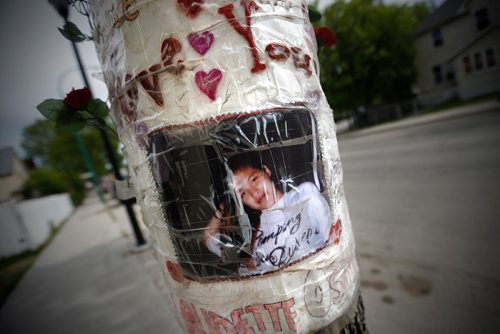 JOHN WOODS / WINNIPEG FREE PRESS
A poster of Claudette Osborne is taped to a tree at the corner of Selkirk Avenue and King Street in Winnipeg Tuesday, May 30, 2017. Osborne   went missing in July, 2008 and her last known location was at a payphone at this intersection.