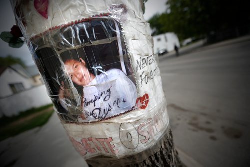JOHN WOODS / WINNIPEG FREE PRESS
A poster of Claudette Osborne is taped to a tree at the corner of Selkirk Avenue and King Street in Winnipeg Tuesday, May 30, 2017. Osborne   went missing in July, 2008 and her last known location was at a payphone at this intersection.