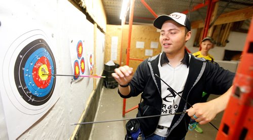 PHIL HOSSACK / WINNIPEG FREE PRESS  -  Manitoba's best archers,  Brady Klassen pulls arrows out of a bullseye Wednesday afternoon at Heartland Archery. See story.   -  May 31 2017