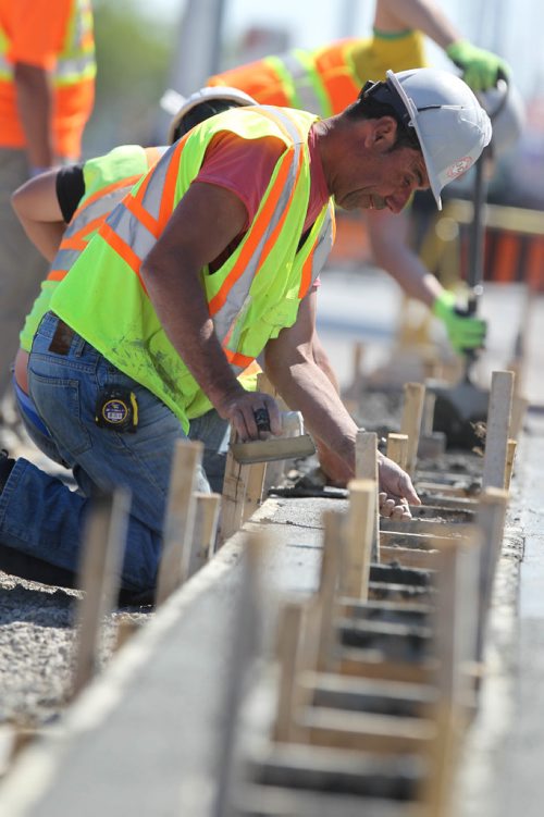 RUTH BONNEVILLE /  WINNIPEG FREE PRESS

Concrete crews work on new bike way in the curb lane heading south down Pembina Hwy near Weatherdon Wednesday.  

See story on bike lanes.  




May 31, 2017