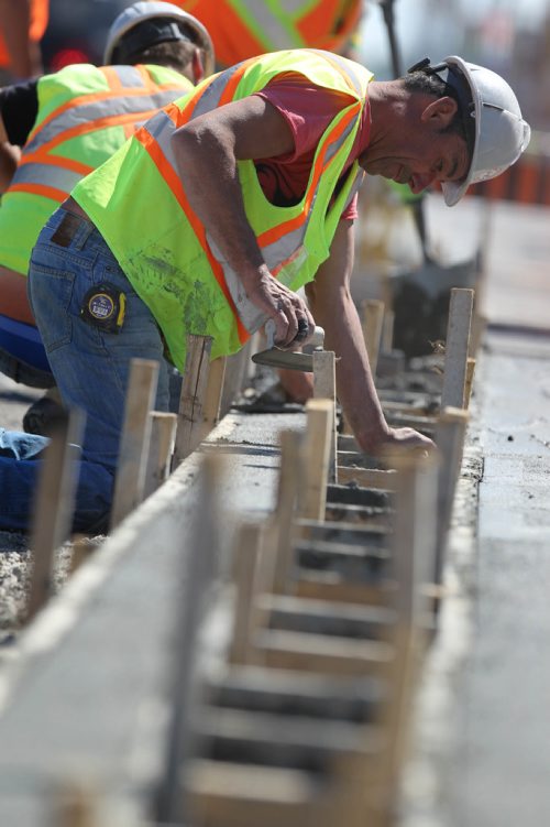 RUTH BONNEVILLE /  WINNIPEG FREE PRESS

Concrete crews work on new bike way in the curb lane heading south down Pembina Hwy near Weatherdon Wednesday.  

See story on bike lanes.  




May 31, 2017