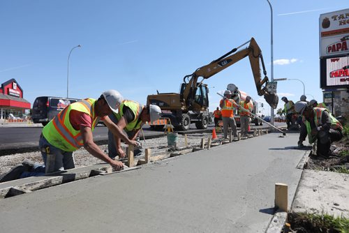 RUTH BONNEVILLE /  WINNIPEG FREE PRESS

Concrete crews work on new bike way in the curb lane heading south down Pembina Hwy near Weatherdon Wednesday.  

See story on bike lanes.  




May 31, 2017