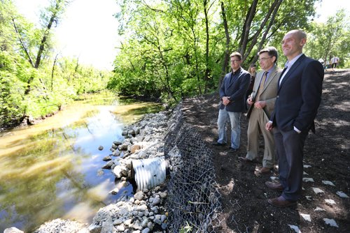 RUTH BONNEVILLE /  WINNIPEG FREE PRESS

Kendall Thiessen, Riverbank Management Engineer, City of Winnipeg, Brian Mayes, City Councillor for St. Vital and Matt Allard Councillor for St. Boniface ward, view the riverbank improvements nearing completion along the Seine River from John Bruce Park at news conference Wednesday.  

May 31, 2017