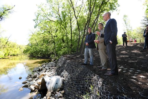 RUTH BONNEVILLE /  WINNIPEG FREE PRESS

Kendall Thiessen, Riverbank Management Engineer, City of Winnipeg, Brian Mayes, City Councillor for St. Vital and Matt Allard Councillor for St. Boniface ward, view the riverbank improvements nearing completion along the Seine River from John Bruce Park at news conference Wednesday.  

May 31, 2017