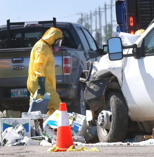 WAYNE GLOWACKI / WINNIPEG FREE PRESS

Liquid herbicide carried by one of the vehicles involved in a collision on the Perimeter Highway at Brady Rd. Thursday morning is loaded up into another vehicle. RCMP said a half-ton pickup truck carrying liquid herbicide was heading eastbound on the Perimeter when it collided with a westbound gravel truck turning left onto Brady Road with a load of dirt.    June 1 2017