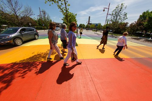 MIKE DEAL / WINNIPEG FREE PRESS
A rainbow pride flag crosswalk has been painted to celebrate the Pride Run which will be taking place on Saturday. The crosswalk was painted by members of a LGBT running organization, Winnipeg Frontrunners, which hosts the Pride Run.
170601 - Thursday, June 01, 2017.