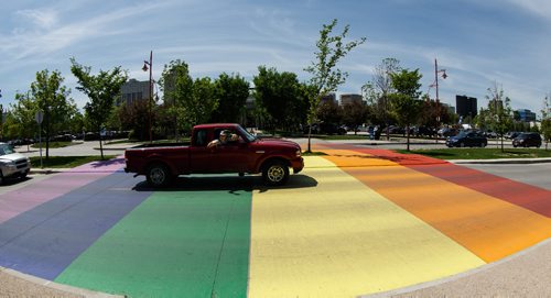 MIKE DEAL / WINNIPEG FREE PRESS
A rainbow pride flag crosswalk has been painted to celebrate the Pride Run which will be taking place on Saturday. The crosswalk was painted by members of a LGBT running organization, Winnipeg Frontrunners, which hosts the Pride Run.
170601 - Thursday, June 01, 2017.