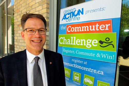 BORIS MINKEVICH / WINNIPEG FREE PRESS
Red River College President and CEO Paul Vogt poses next to a Commuter Challenge poster. The annual Commuter Challenge is a national celebration of healthy and sustainable transportation taking place during the first week of June. Close to 8,000 Manitobans participate every year by taking the bus, carpooling, walking or cycling to work. Winnipeg has won the past 12 out of 13 years as the top performing city in Canada. Photo taken at Red River College, Paterson GlobalFoods Institute, Bijou Park. Green Action Centre. June 1, 2017
