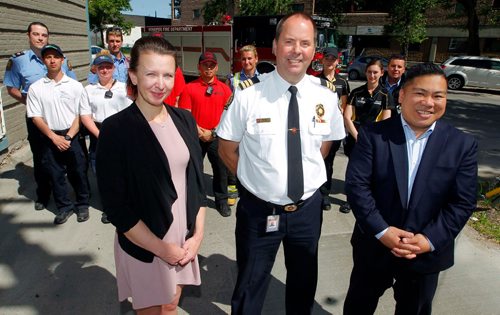 BORIS MINKEVICH / WINNIPEG FREE PRESS
Winnipeg Fire Paramedic Service partners with local BIZ groups to help reduce the risk of arson this summer. From left, Jennifer Mathieson, Past Chair, Winnipeg BIZ Alliance, Mark Reshaur, Assistant Chief, Winnipeg Fire Paramedic Service, and Mike Pagtakhan, City Councillor for Point Douglas and Chair of the Standing Policy Committee on Protection, Community Services and Parks. They pose for a photo at the press conference in the back lane behind 469 Kennedy Street. Ashley Prest  story. June 2, 2017
