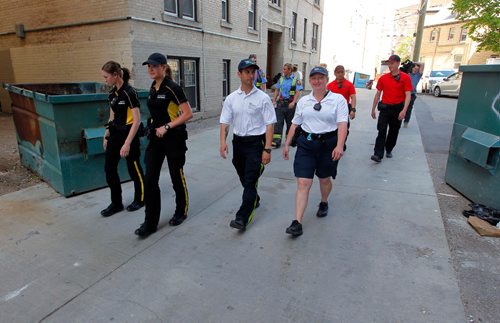 BORIS MINKEVICH / WINNIPEG FREE PRESS
Winnipeg Fire Paramedic Service partners with local BIZ groups to help reduce the risk of arson this summer. Here the groups searches the back lane in the 400 block of Kennedy Street for any potential arson hazards. Ashley Prest story. June 2, 2017
