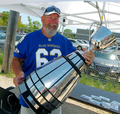BORIS MINKEVICH / WINNIPEG FREE PRESS
Photo of former Winnipeg Blue Bomber Chris Walby with the Grey Cup at Rasco FR on Mountain Ave. The company is proud to be launching its Canadian flagship store in Winnipeg. Rasco FR Grand Opening today and tomorrow (Friday, June 2 and Saturday, June 3) A meet and greet and pictures with Winnipeg Blue Bombers CFL Alumni Chris Walby, and The Grey Cup. A complimentary Dannys Whole Hog BBQ and Smokehouse lunch was served. June 2, 2017
