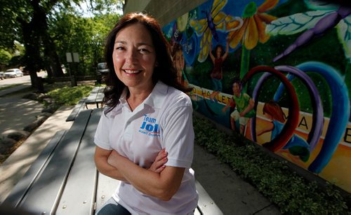 PHIL HOSSACK / WINNIPEG FREE PRESS  -  Jodi Moskal, Conservative candidate in Point Douglas poses beside a mural at Norquay School Friday. See story.  -  June 2, 2017