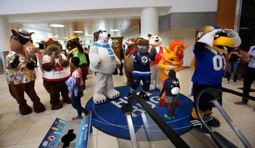 WAYNE GLOWACKI / WINNIPEG FREE PRESS

 A dozen mascots delivered smiles and high fives for the afternoon arrivals on the Hug Rug at the James A. Richardson International Airport Friday as part of Tourism Winnipegs Annual Mascot Invasion at the airport to celebrate Tourism Week in Canada. June 2 2017
