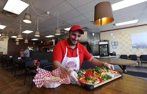 RUTH BONNEVILLE /  WINNIPEG FREE PRESS

Restaurant Review:  Les Saj, Middle Eastern on St. James. Part owner Adam Tayfour, makes  saj bread and Mezza platter. Saj bread is baked on a big heated dome   and is super thin.  Mezza platter is a appetizer platter.   They can include homemade humus, falafel balls as well as dips, fries and veggies.
See Alison Gilmor review. 

June 02, 2017