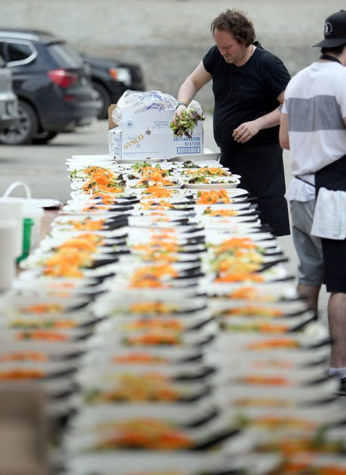 JASON HALSTEAD / WINNIPEG FREE PRESS

Kitchen staff prep salads at the Table for 1200 More on Rorie Street in the east Exchange and around the Richardson Building on June 3, 2017. (See Social Page)