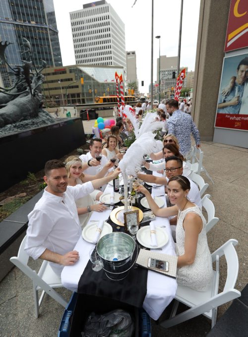 JASON HALSTEAD / WINNIPEG FREE PRESS

Staff from Garden City Dental Centre at the Table for 1200 More dinner on Rorie Street in the east Exchange and around the Richardson Building on June 3, 2017. (See Social Page)