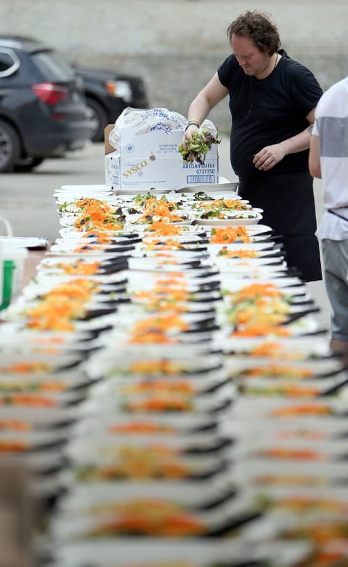 JASON HALSTEAD / WINNIPEG FREE PRESS

Kitchen staff prep salads at the Table for 1200 More on Rorie Street in the east Exchange and around the Richardson Building on June 3, 2017. (See Social Page)