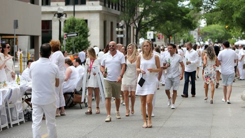 JASON HALSTEAD / WINNIPEG FREE PRESS

Guests arrive for the Table for 1200 More dinner on Rorie Street in the east Exchange and around the Richardson Building on June 3, 2017. (See Social Page)