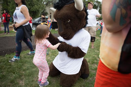 JEN DOERKSEN/WINNIPEG FREE PRESS
A child plays with the bison mascot from the University of Manitoba float at the 30th annual Pride Parade. Sunday, June 4, 2017.
