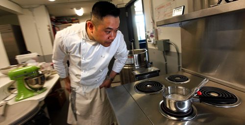 PHIL HOSSACK / WINNIPEG FREE PRESS  -  INTERSECTION - "S Squared Patisserie" Chef Sophon Chhin watches the temperature of ingredients warming on the stove Monday at the Riverview Community Centre where he uses the kitchen to churn out sweet pasteries and more.   See Dave Sanderson story.  -  June 2, 2017