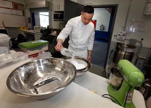 PHIL HOSSACK / WINNIPEG FREE PRESS  -  INTERSECTION - "S Squared Patisserie" Chef Sophon Chhin meaures out the parts of macarons Monday at the Riverview Community Centre where he uses the kitchen to churn out sweet pasteries and more.   See Dave Sanderson story.  -  June 2, 2017