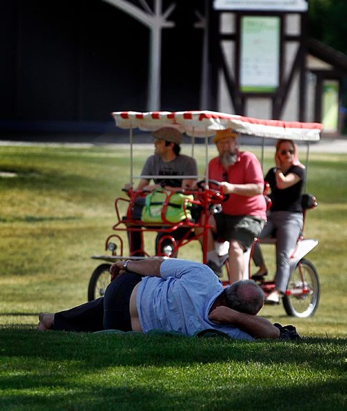 PHIL HOSSACK / WINNIPEG FREE PRESS  -  A hot humid afternoon had some out riding in the sun while others prefer to keep cool lounging in the shade. See story re: Global Warming temps increase in Winnipeg. . Jun 5, 2017