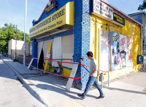 BORIS MINKEVICH / WINNIPEG FREE PRESS
Hadeda Convenience Store on Selkirk and Parr was hit by a MVC last night at around 3 am. No id on the kid walking by. ASHLEY PREST STORY. June 6, 2017
