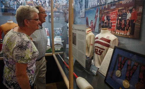 MIKE DEAL / WINNIPEG FREE PRESS
Erna Iwanoczko and her husband Don check out the new exhibits. Their son Dale Iwanoczko a volleyball star from Selkirk, MB who died of cancer at 30yrs-old, but competed in the Pan Am Games in Cuba in 1991 and is a member of the Manitoba Sports Hall of Fame.
The Manitoba Sports Hall of Fame opened a new exhibit in its gallery in the Canada Games Sport for Life Centre at 145 Pacific Avenue showcasing a half a century of Canada Games' history. Several Canada Games alumni were invited to the opening just before lunch Tuesday morning.
170606 - Tuesday, June 06, 2017.