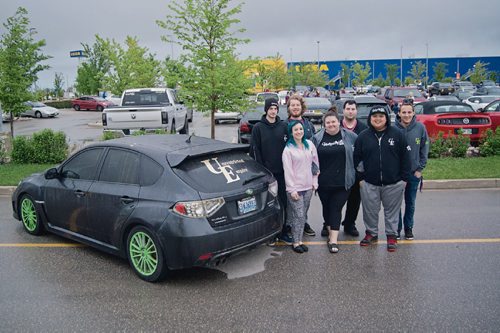 Canstar Community News May 28, 2017 - Organizers of Unrestricted Empire, a group of car enthusiasts who meet at 550 Sterling Lyon Parkway each Sunday, are pictured in the lot on a rainy evening. The meet-up has attracted up to 2,000 vehicles to the area in one night and is gaining notoriety due to its inclusive ethos. Pictured back row from left: Scott Hobday, staff; Colin Fiola, co-founder; Deameon Hutchison, staff; and Ryan Tront; staff. Front row from left: Kristina Hailey, co-founder; Amber Doucette, staff; and Kris Espineli, staff. (Danielle Da Silva/Canstar/Souwester