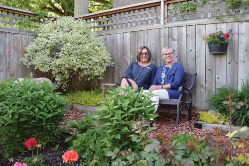 Canstar Community News Ursula MacKenzie (left) and Urban Retreats Garden Tour committee member Ruth Booth take a seat in MacKenzie's garden, which is one of the stops on the June 17 tour. (DARREN RIDGLEY/THE METRO/CANSTAR)