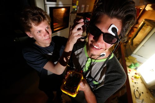 JOHN WOODS / WINNIPEG FREE PRESS
Grade twelve students Matthew Hewlett (L) and Caleb Turon are photograph with their invention at Assent Works Tuesday, June 26, 2017. The friends have developed a device which uses Transcranial Direct Current Stimulation (tDCS) to stimulate different parts of the brain
and assist those with acquired blindness with navigation.