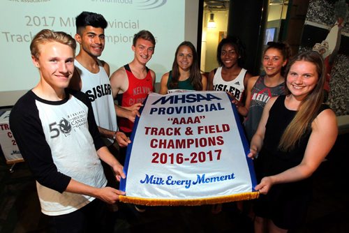 BORIS MINKEVICH / WINNIPEG FREE PRESS
PROVINCIAL HIGH SCHOOL
TRACK & FIELD CHAMPIONSHIP MEDIA RECEPTION. Location Sport for Life Centre 145 Pacific Avenue. Athletes from left, Vincent Massey Trojans Alec Dickson, Sisler Spartans Harjaspreet Poonia, Kelvin Clippers Erik Urbanovich, Vincent Massey Trojans Victoria Tachinski, Sisler Spartins Brianna Tynes, Kelvin Clippers Erin Valgardson, and Dakota Lancers Sarah Smith pose for a photo with the championship banner at the event. TAYLOR ALLEN STORY. June 7, 2017
