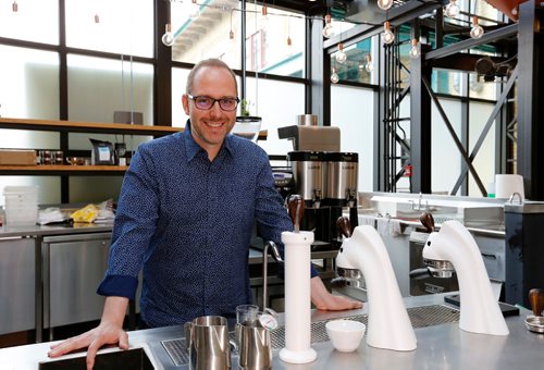 JUSTIN SAMANSKI-LANGILLE / WINNIPEG FREE PRESS
James Magnus-Johnston poses behind the counter at the second Fools+Horses location at The Forks Common building. The new location opens June 12.
170607 - Wednesday, June 07, 2017.